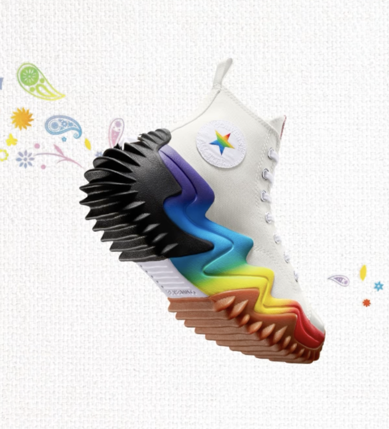 A Converse Run Star Motion Platform Pride shoe, exhibiting a white canvas body and rainbow sole with deep tread.